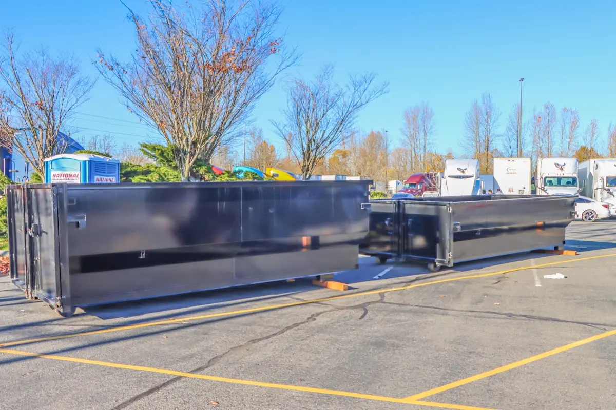 Professional dumpster rental service with roll-off container on residential driveway in Glenolden